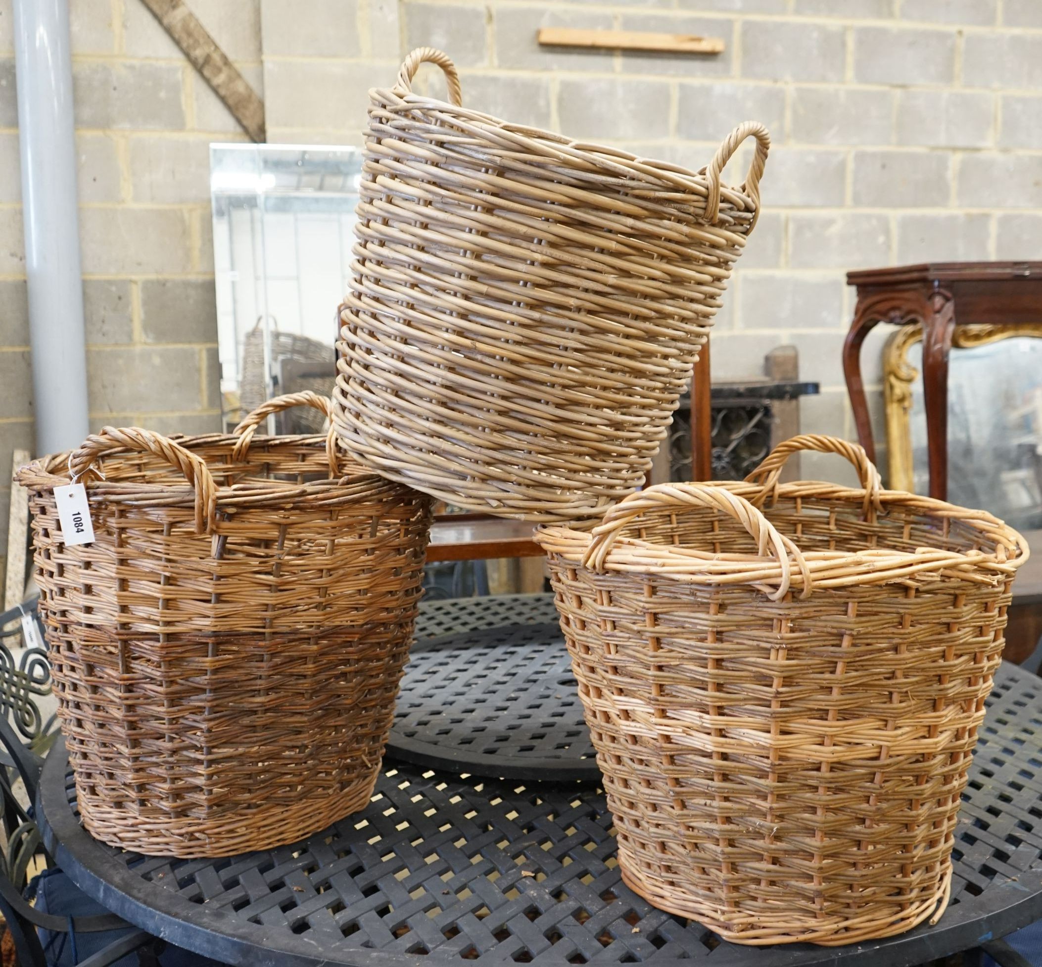 Three aassorted wicker baskets, largest width 59cm, height 53cm